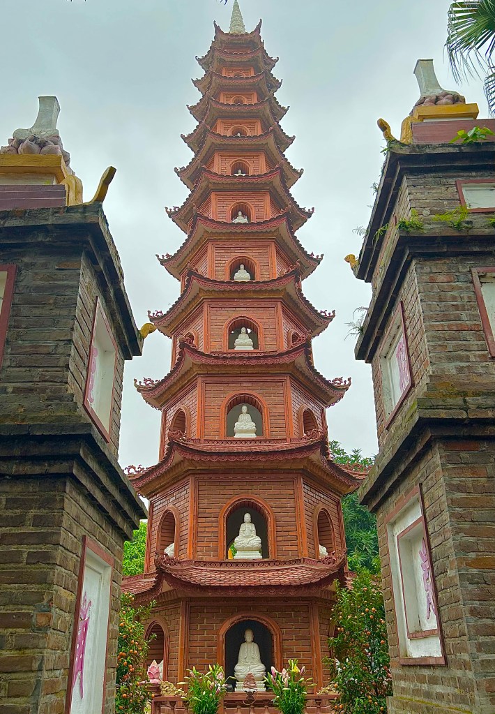The multi-tiered tower adorned with traditional Vietnamese design elements